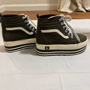 High-top, lace-up platform sneakers.